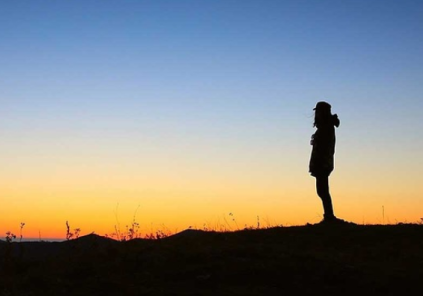 standing in stillness at dusk