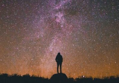 figure gazing at night sky